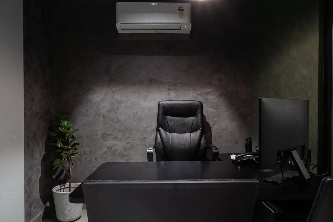 empty executive desk with light shining down
