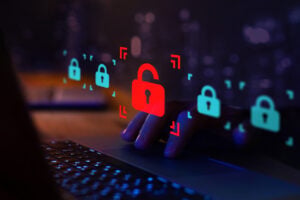 data breach, signified by lock symbols and laptop