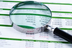 magnifying glass on a spreadsheet